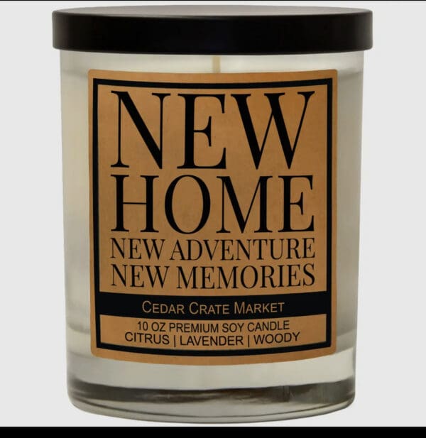 A candle that says new home, new adventure, new memories.